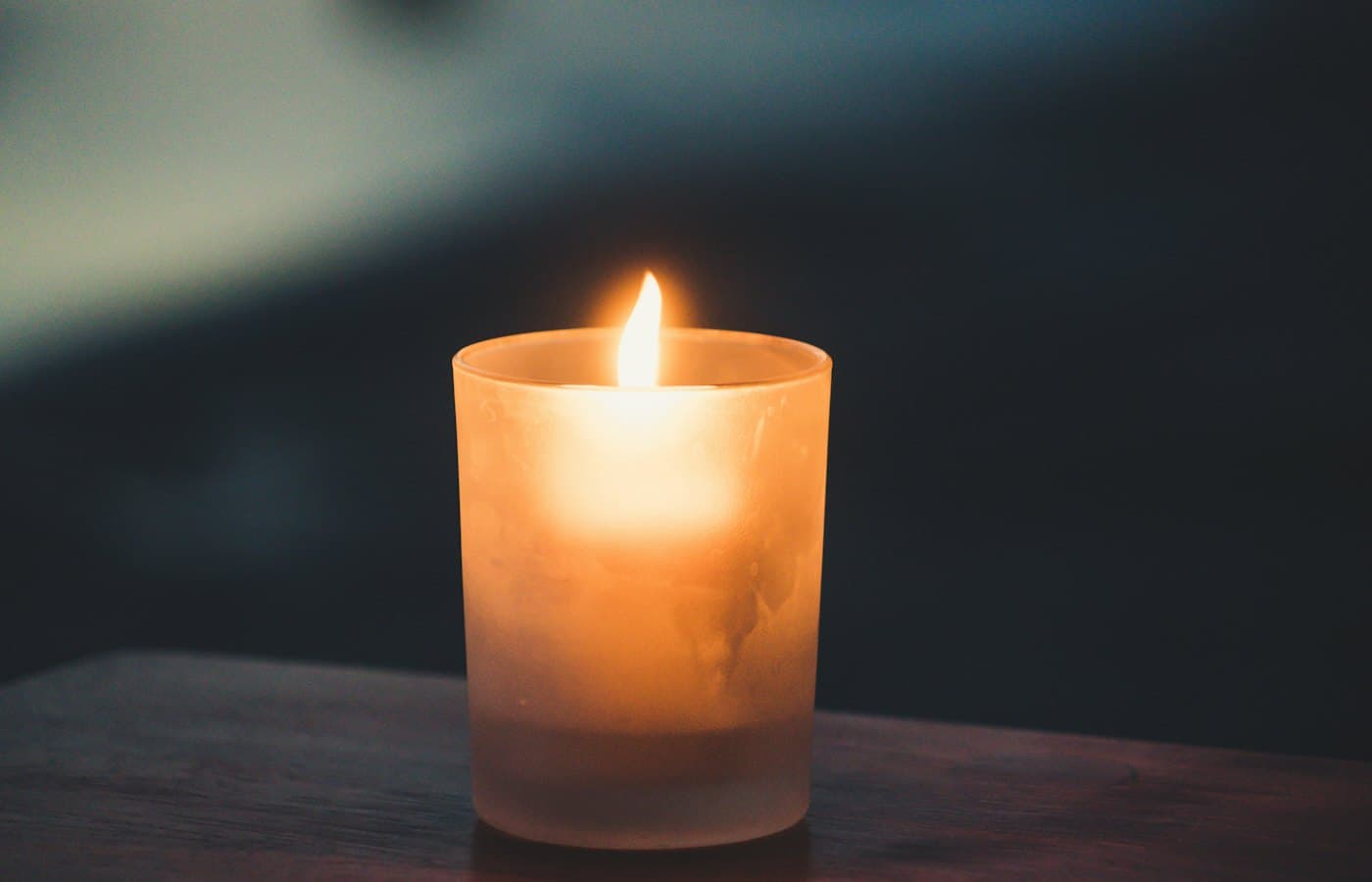 Tea light on brown surface
