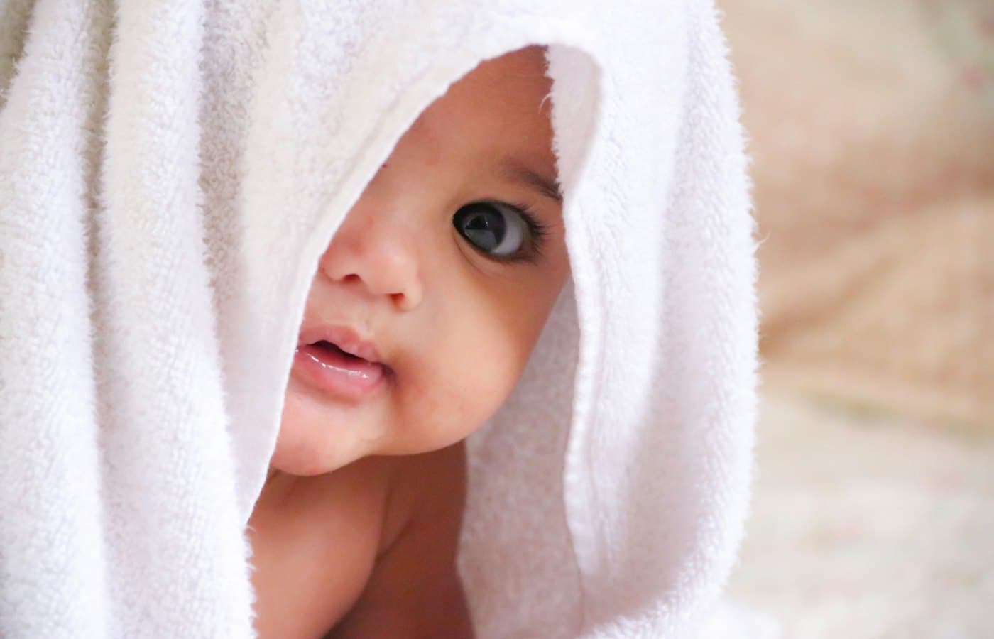Baby doll covered with white towel