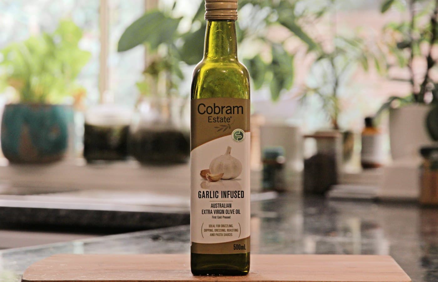 A bottle of garlic oil sitting on top of a counter