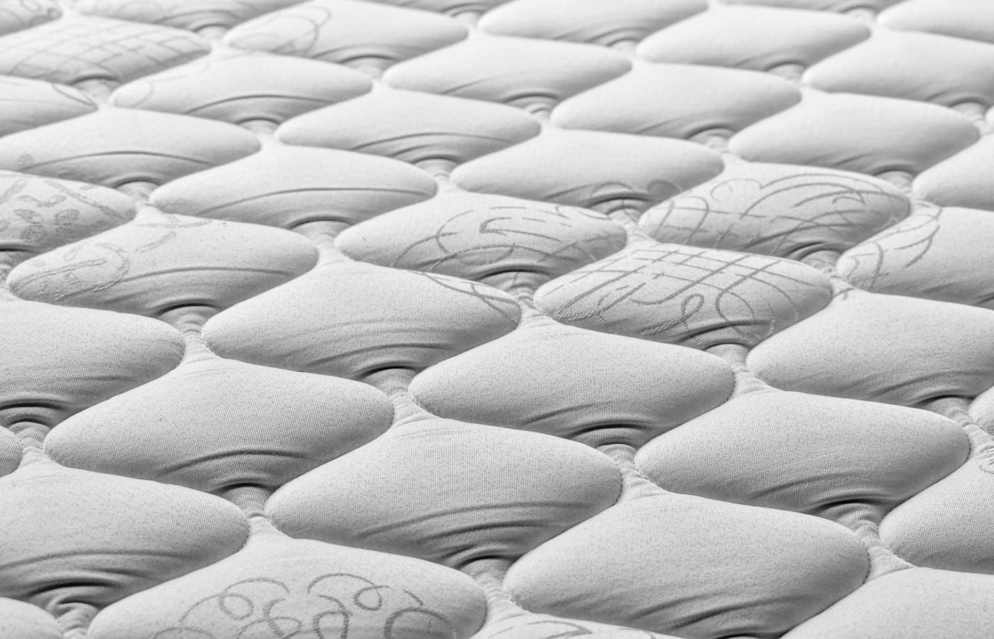 A close up of a mattress that has been made