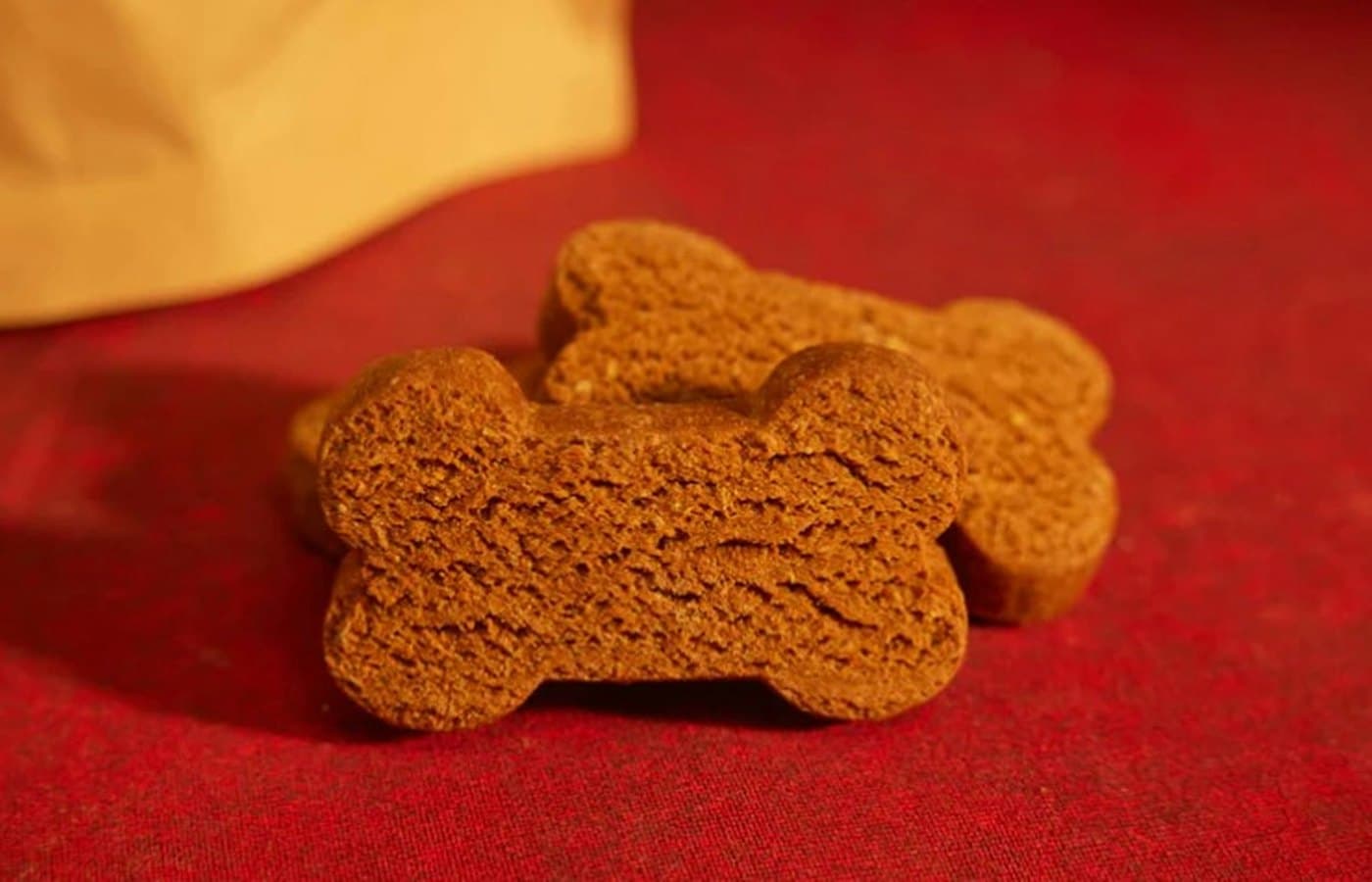 A close up of a dog toy on a red surface