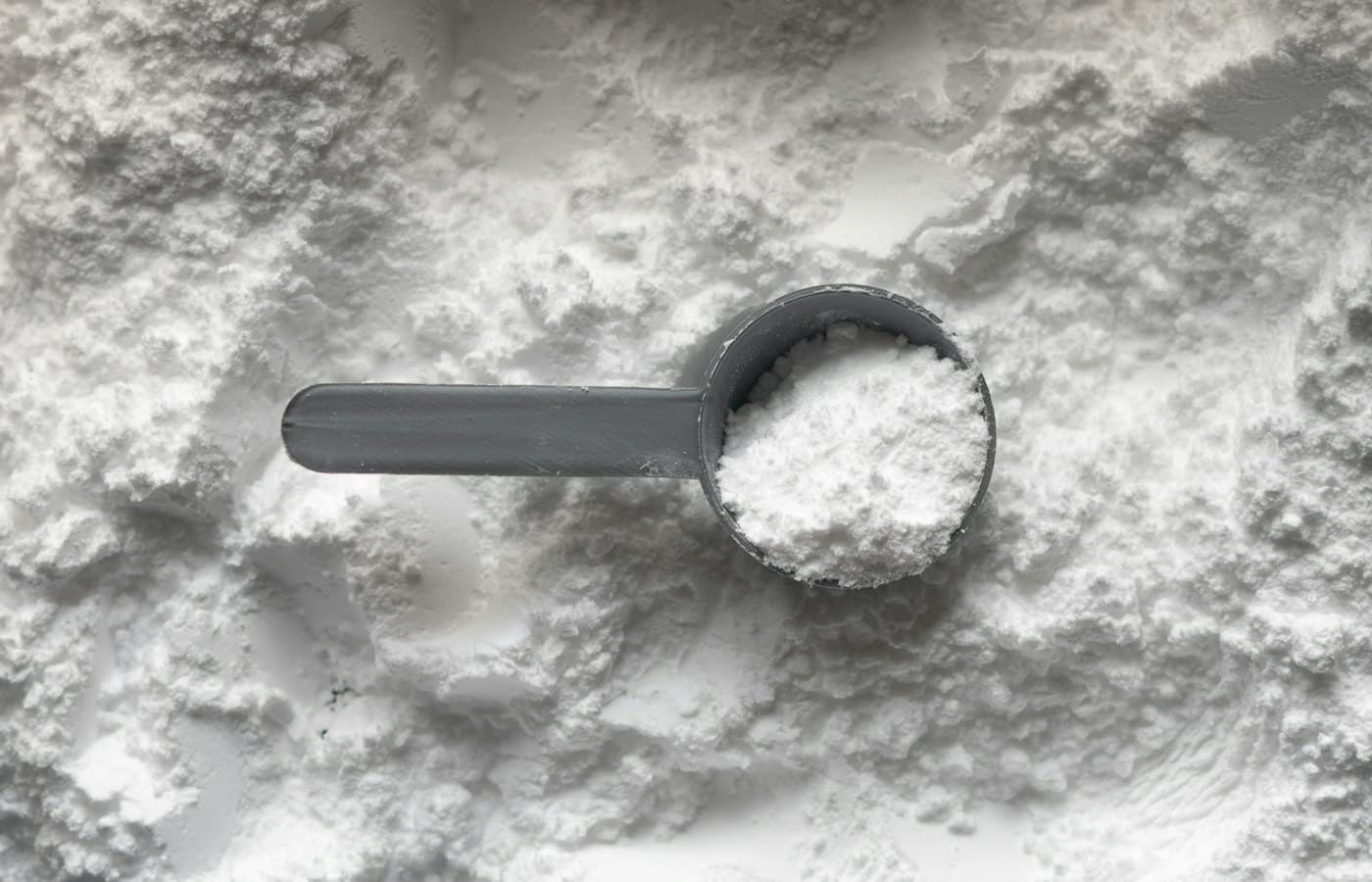 Scoop with white powder