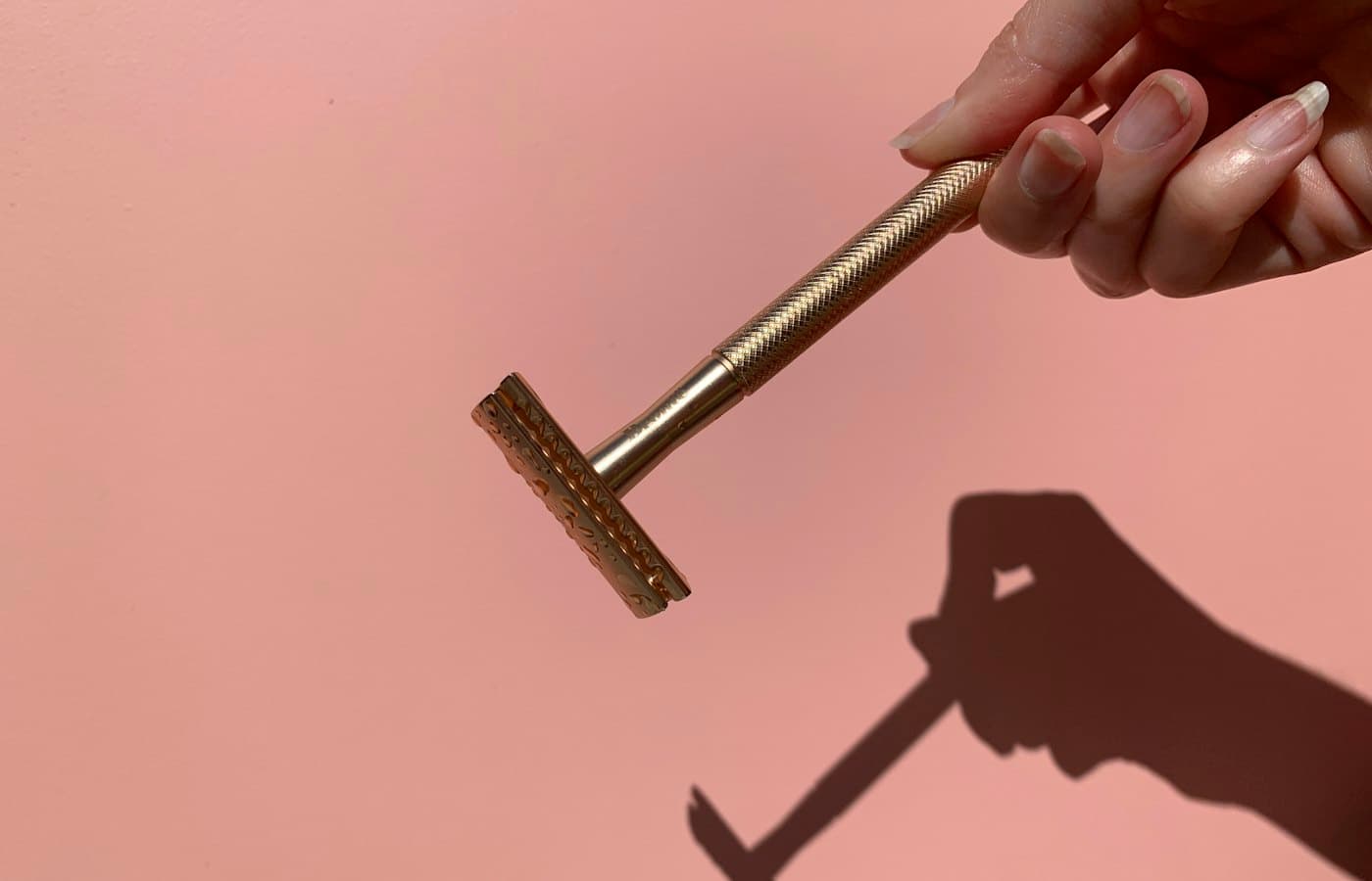 Person holding gray metal tool