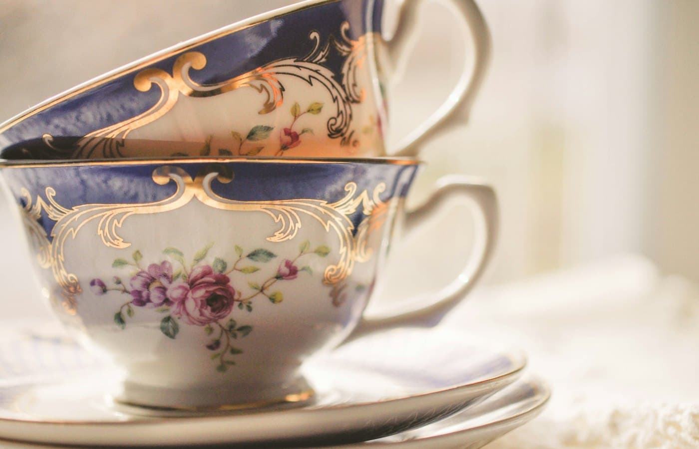 A stack of tea cups sitting on top of a saucer