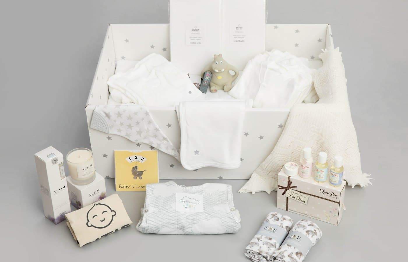 A babys gift hamper with its contents laid out
