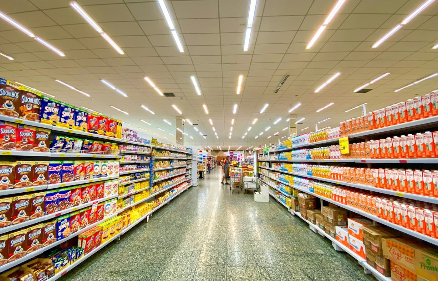 Grocery store aisle with stocked shelves