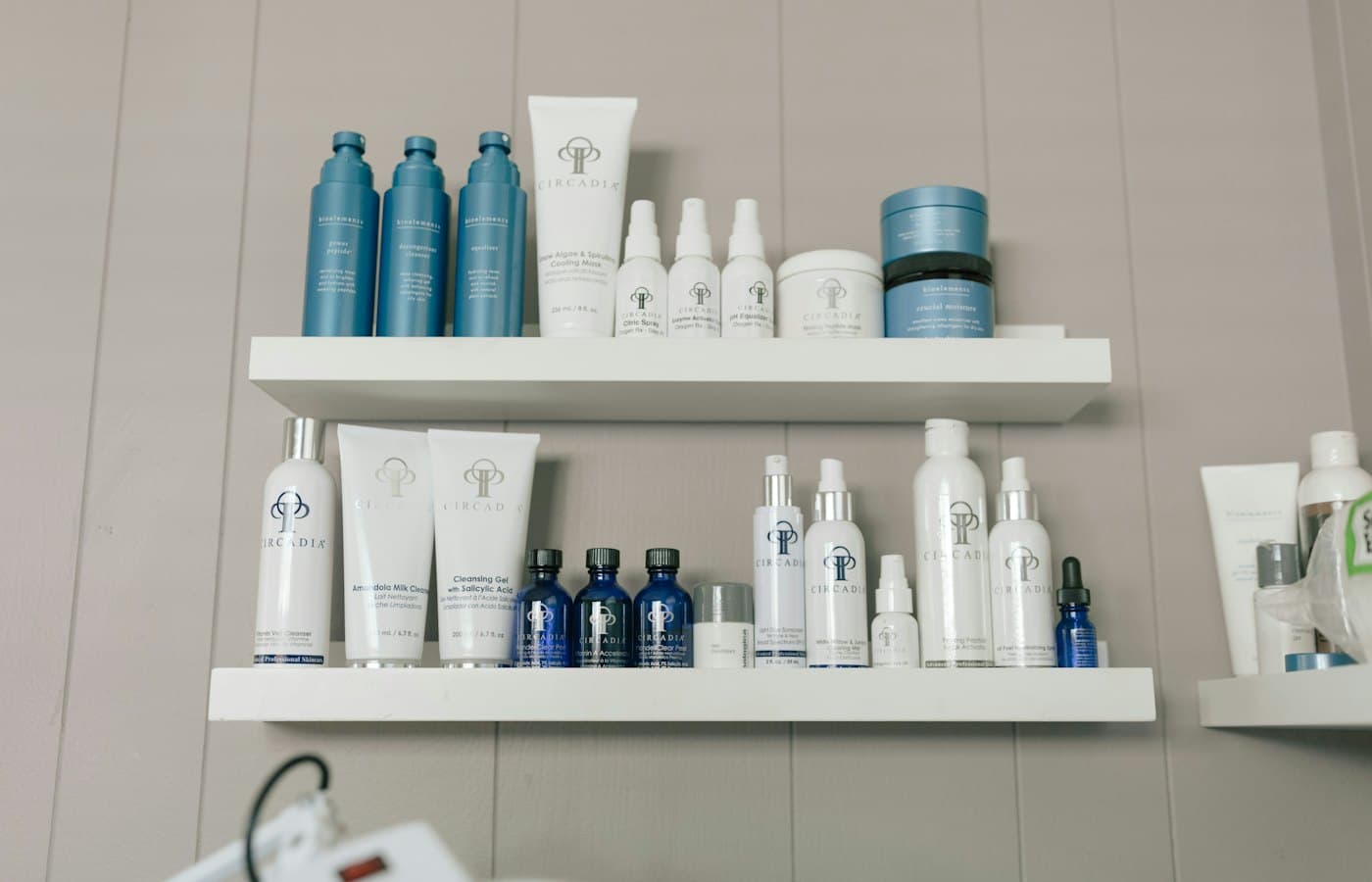 A shelf filled with lots of different types of skin care products